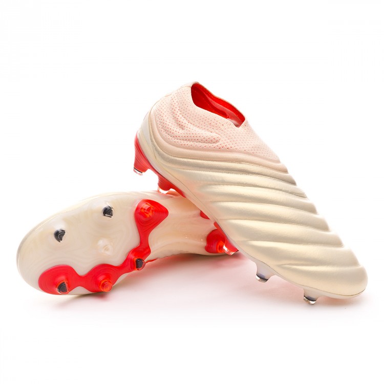 red laceless football boots