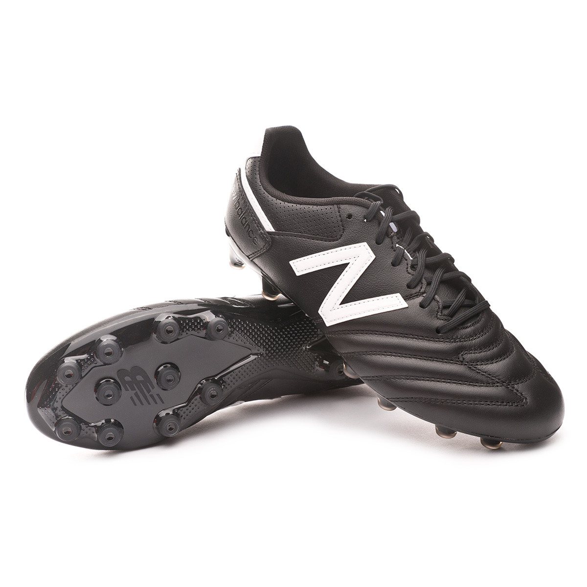 black and white new balance football boots