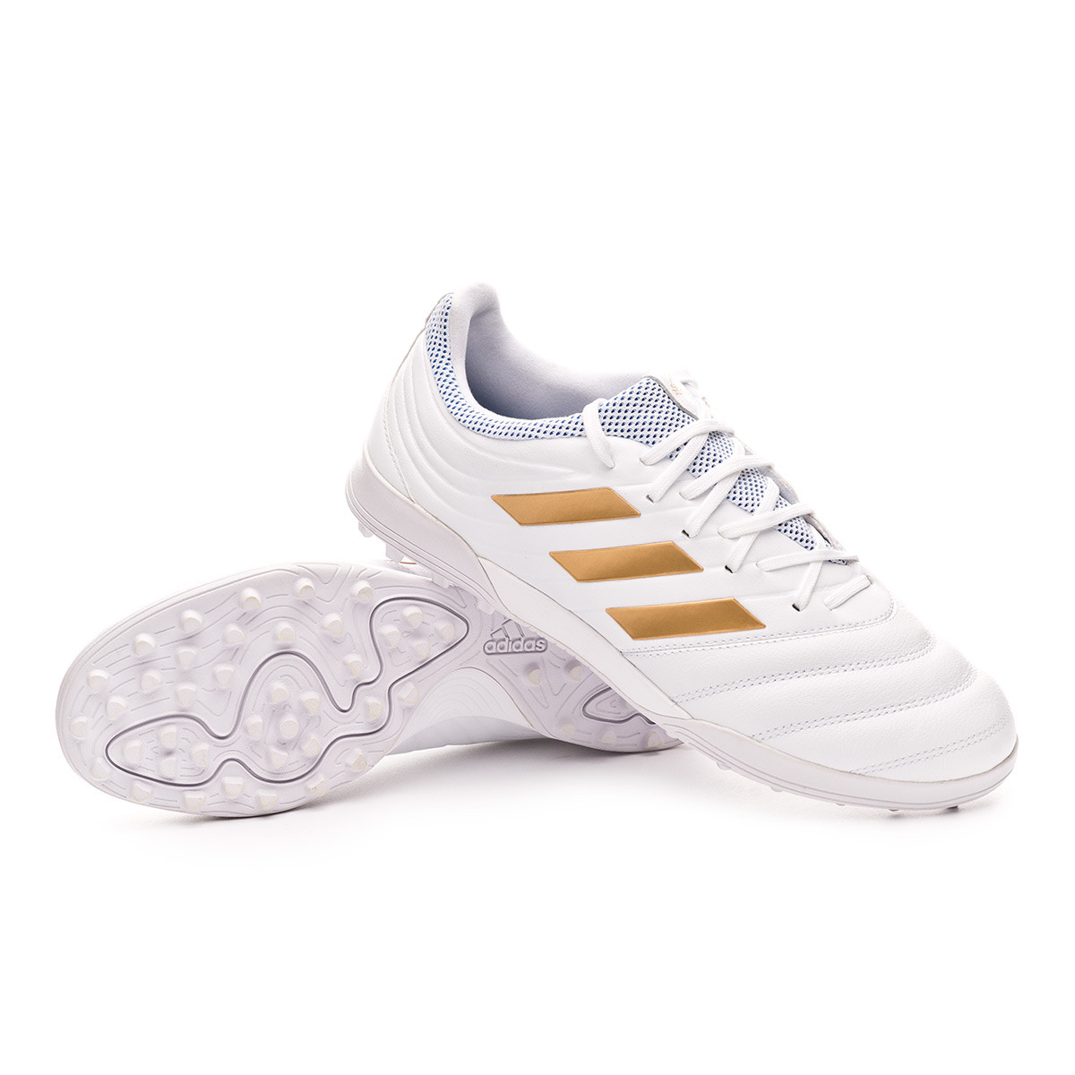 white and gold turf shoes