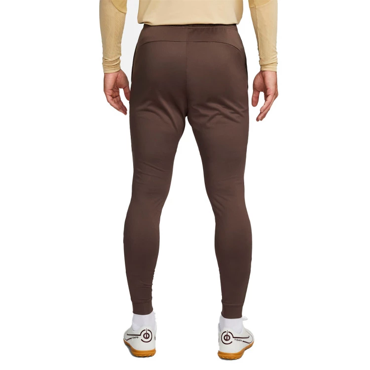 pantalon-largo-nike-tottenham-training-2023-2024-adulto-ironstone-team-gold-no-sponsor-3rd-1