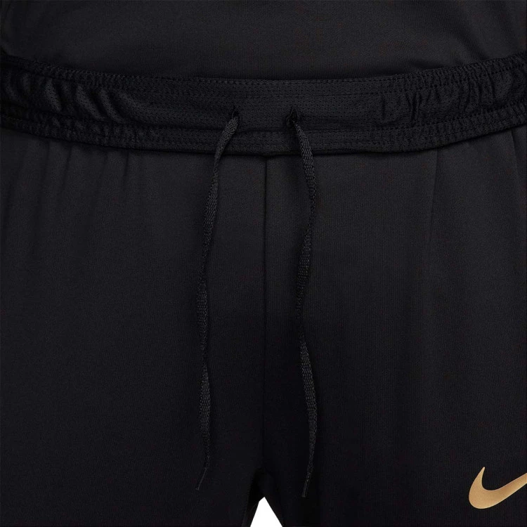 pantalon-largo-nike-dri-fit-strike-mujer-black-jersey-gold-metallic-gold-2