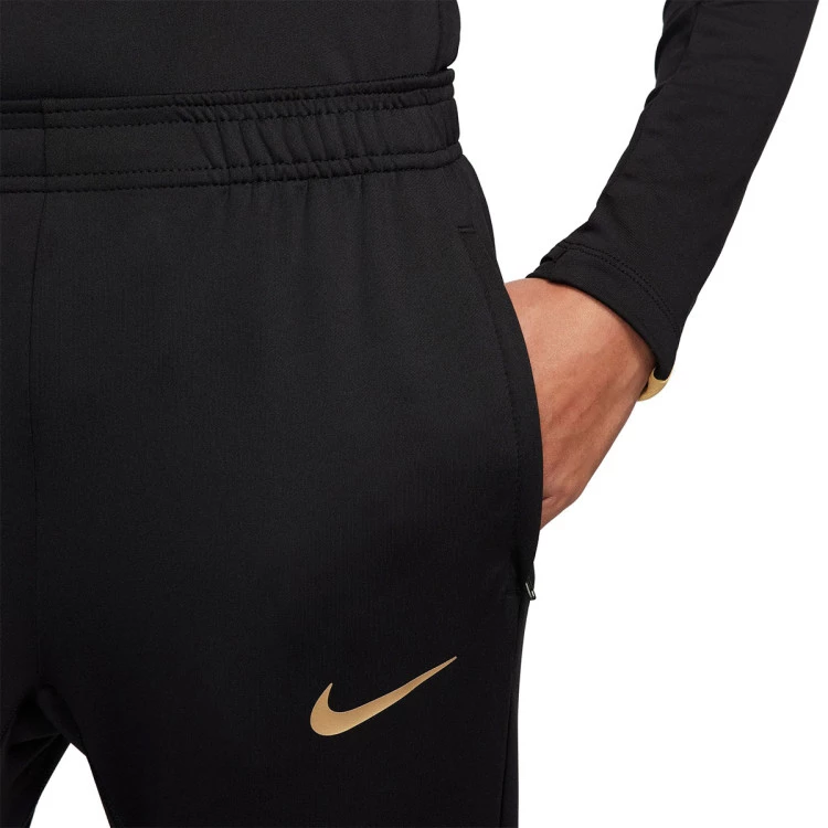 pantalon-largo-nike-dri-fit-strike-mujer-black-jersey-gold-metallic-gold-3