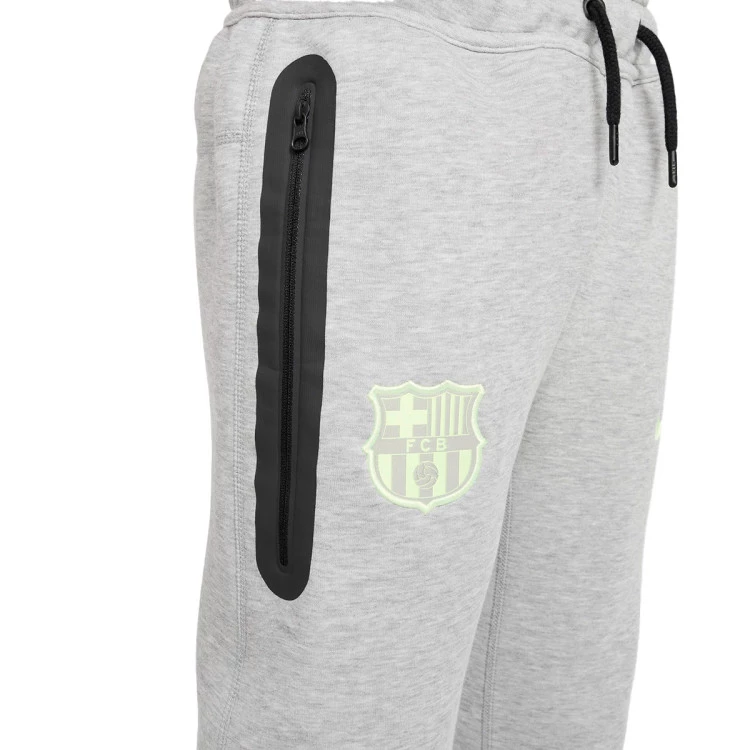 pantalon-largo-nike-fc-barcelona-fanswear-2024-2025-nino-dark-grey-heather-barely-volt-4