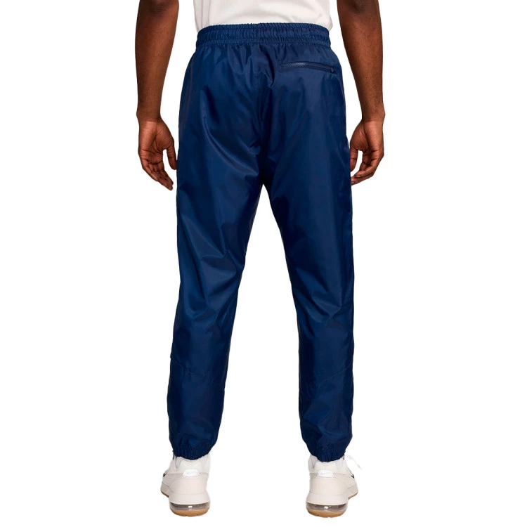 pantalon-largo-nike-psg-fanswear-2024-2025-midnight-navy-metallic-gold-1